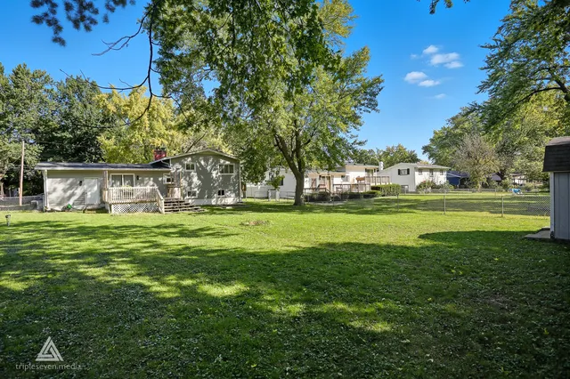 a view of a house with a big yard