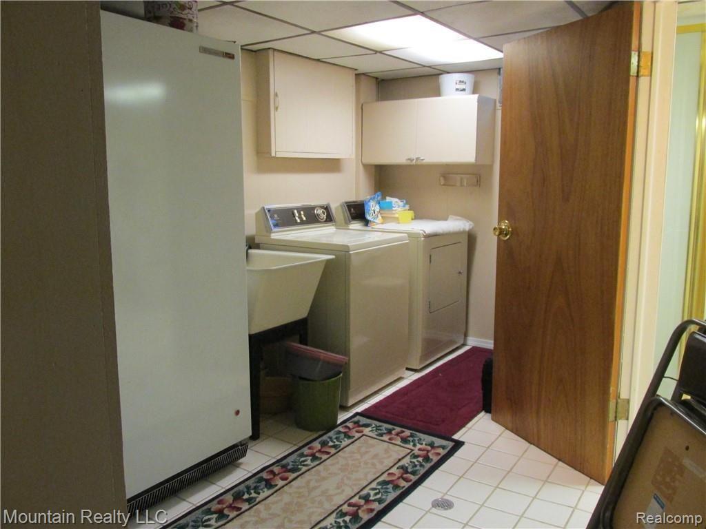 3334 Mann Road Clarkston, MI 48346 - Photo 16 of 23 LAUNDRY ROOM CERAMIC FLOOR
