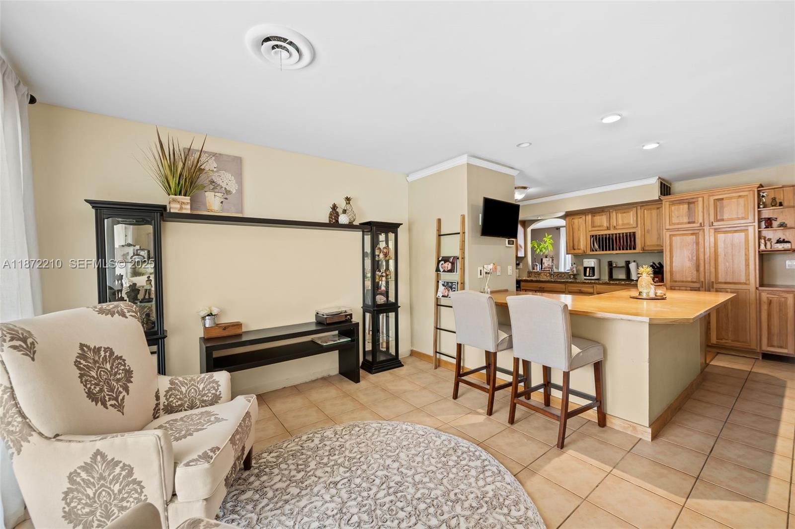 1925 North 39th Avenue Hollywood, FL 33021 - Photo 7 of 20 a living room with a couch and a dining table