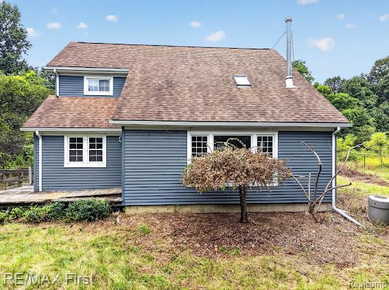 56375 Bates Road New Baltimore, MI 48051 - Photo 1 of 35 Blue horizontal siding exterior with white trim windows