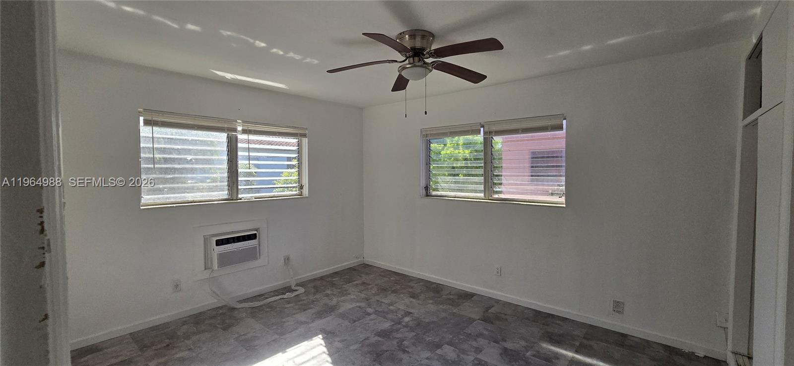 744 85th Street, Unit 1 Miami Beach, FL 33141 - Photo 11 of 17 an empty room that has a window