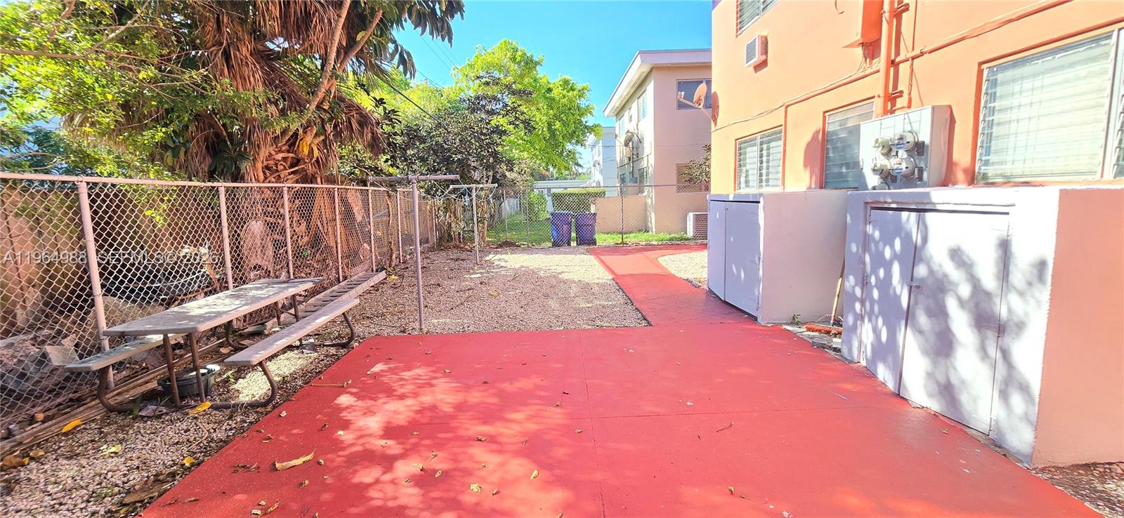 744 85th Street, Unit 1 Miami Beach, FL 33141 - Photo 12 of 17 a view of a backyard with wooden fence