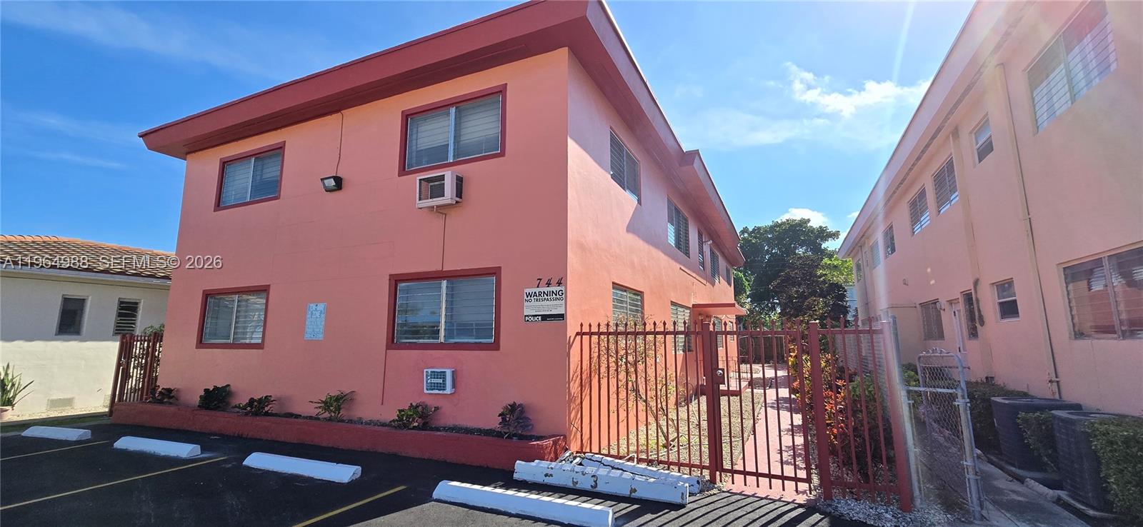 744 85th Street, Unit 1 Miami Beach, FL 33141 - Photo 2 of 17 a front view of a house with a yard