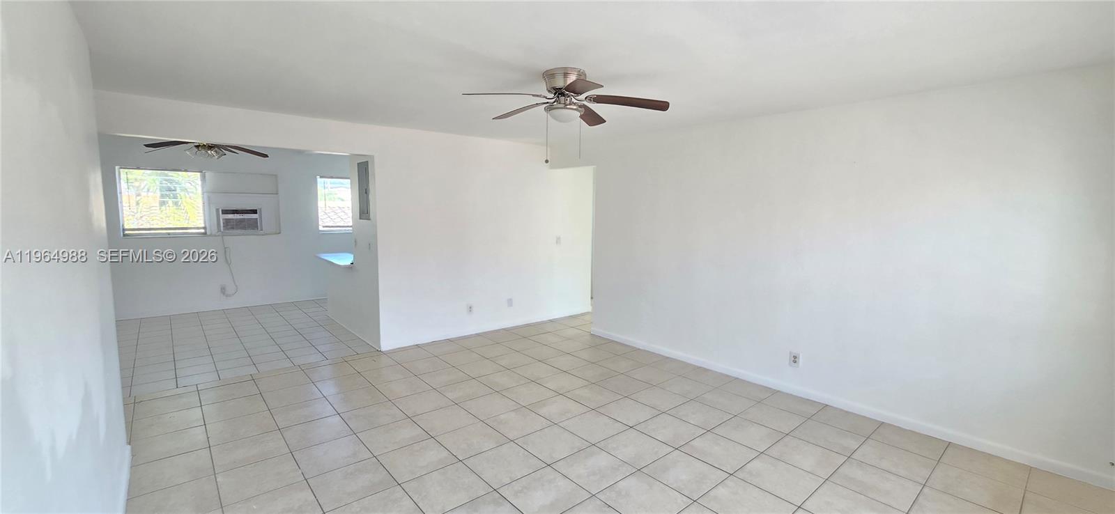 744 85th Street, Unit 1 Miami Beach, FL 33141 - Photo 5 of 17 a view of a room with white walls and white walls