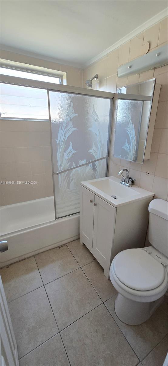 744 85th Street, Unit 1 Miami Beach, FL 33141 - Photo 10 of 17 a bathroom with a toilet a sink and a shower