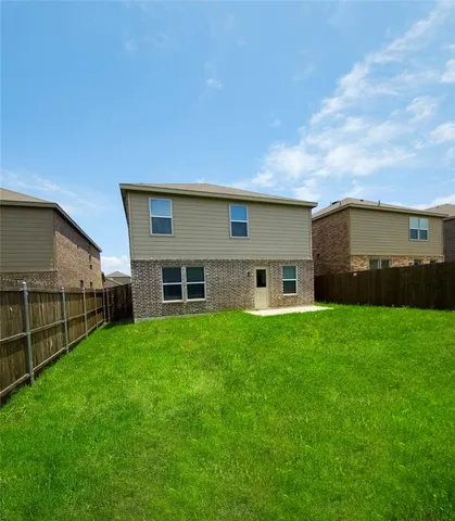 a house view with a garden space
