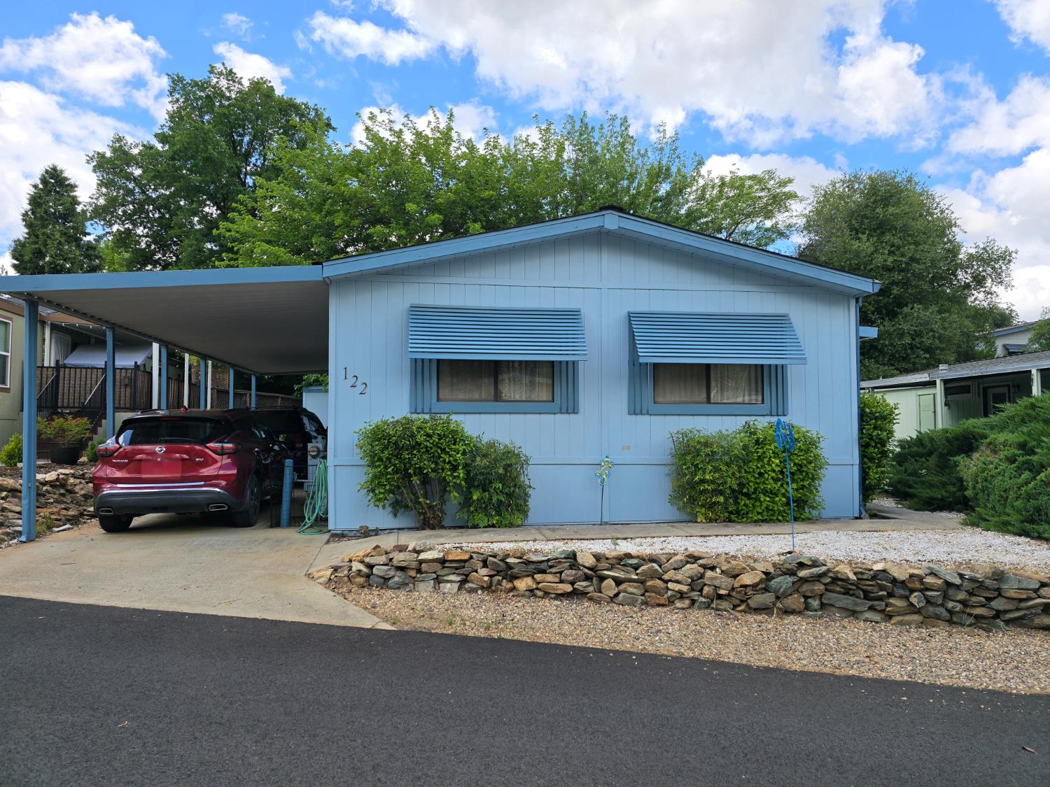 front view of a house with a yard