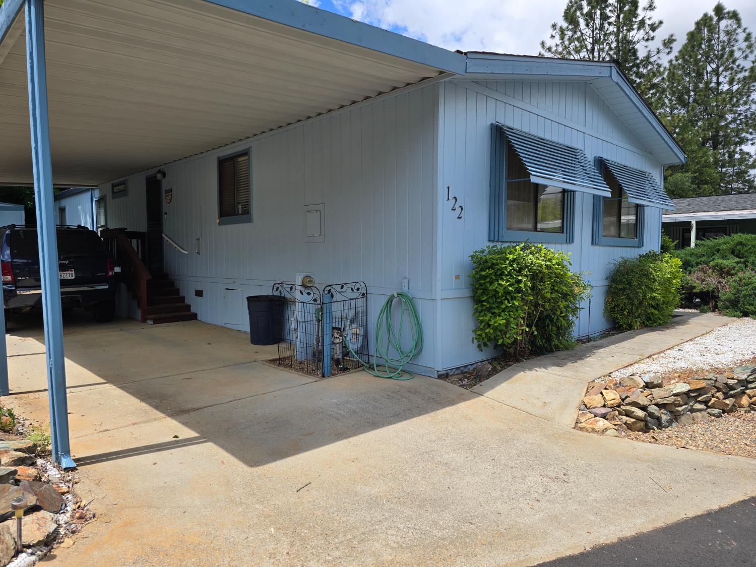 18717 Mill Villa Road, Unit 122 Jamestown, CA 95327 - Photo 2 of 14 a view of a house with a patio