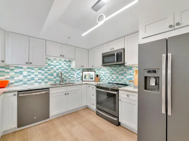 a view of a chairs and table in patio