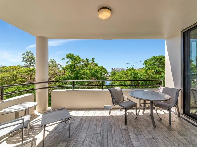 a bedroom with furniture and a flat screen tv