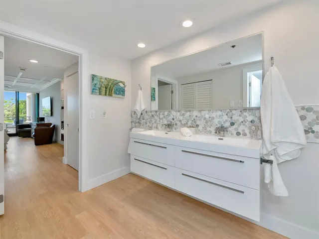 a outdoor sitting area with furniture and wooden floor