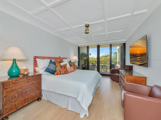 a living room with lots of furniture and a book shelf
