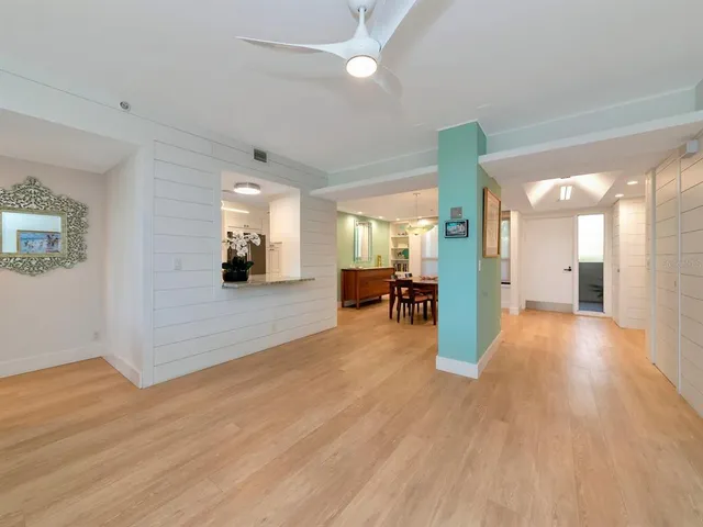 a kitchen with stainless steel appliances granite countertop a refrigerator and stove