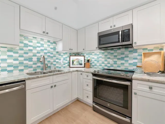 a view of a chairs and table in patio