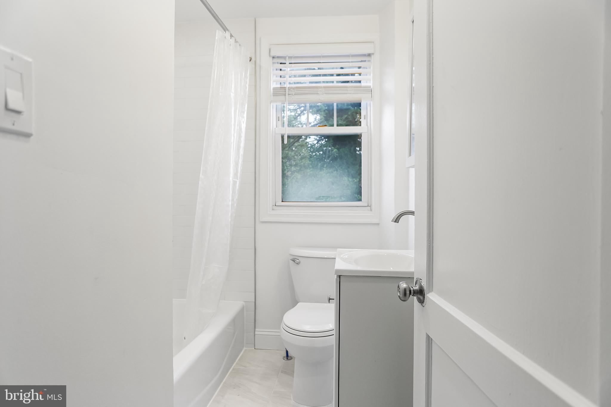 1913 Winton Avenue Havertown, PA 19083 - Photo 11 of 17 a bathroom with a toilet a sink and shower
