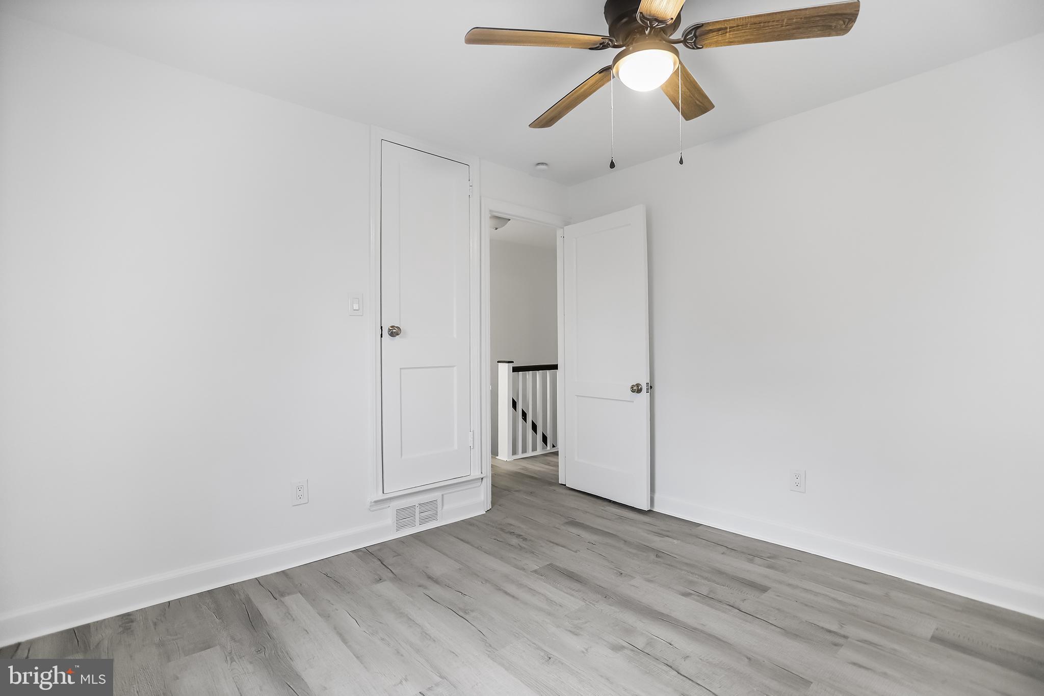1913 Winton Avenue Havertown, PA 19083 - Photo 15 of 17 an empty room with wooden floor ceiling fan and window