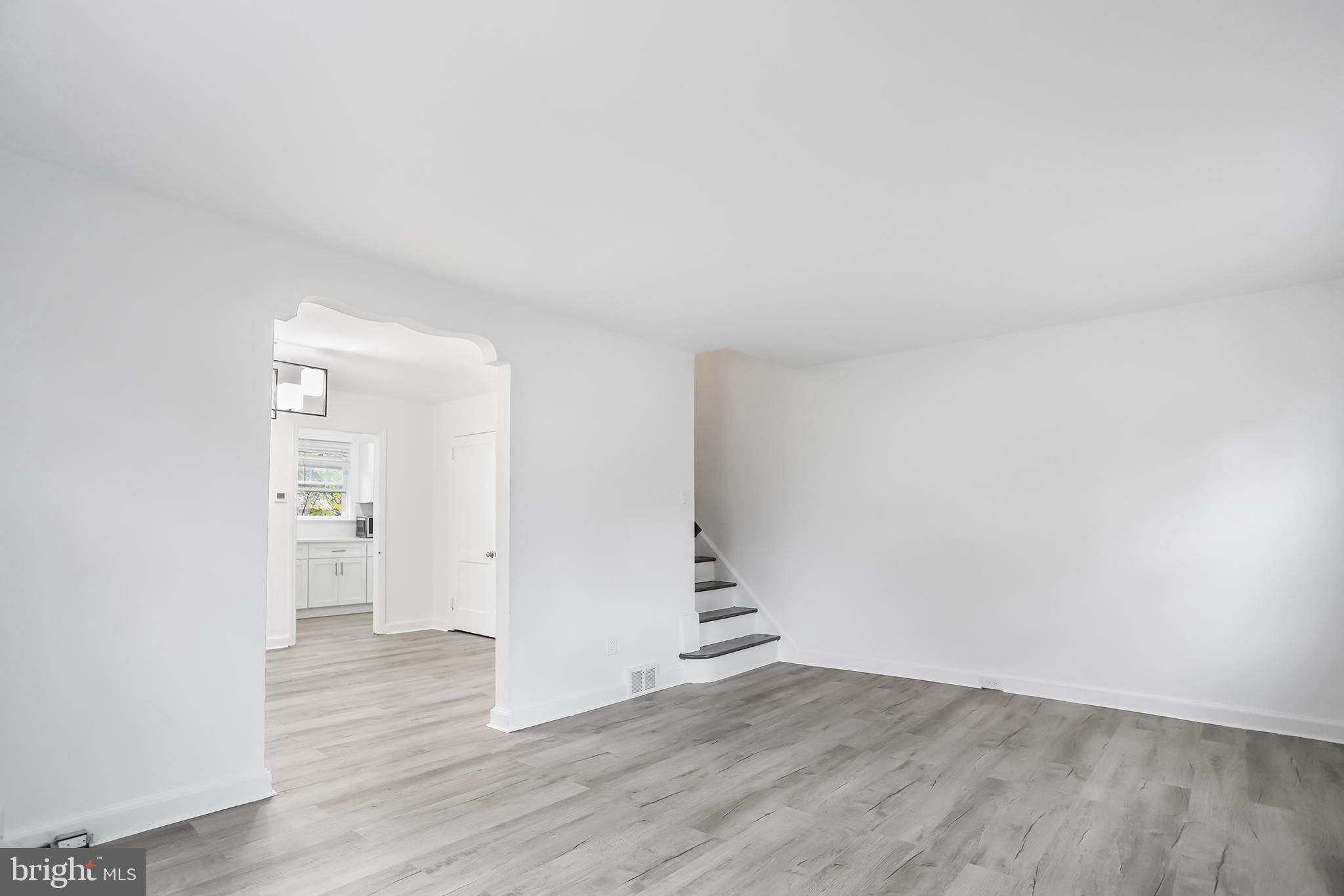 1913 Winton Avenue Havertown, PA 19083 - Photo 2 of 17 an empty room with wooden floor & windows