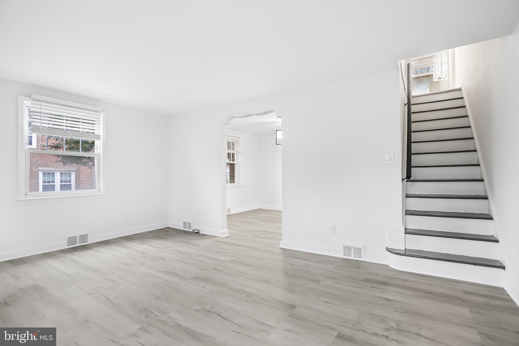 1913 Winton Avenue Havertown, PA 19083 - Photo 3 of 17 an empty room with wooden floor and windows