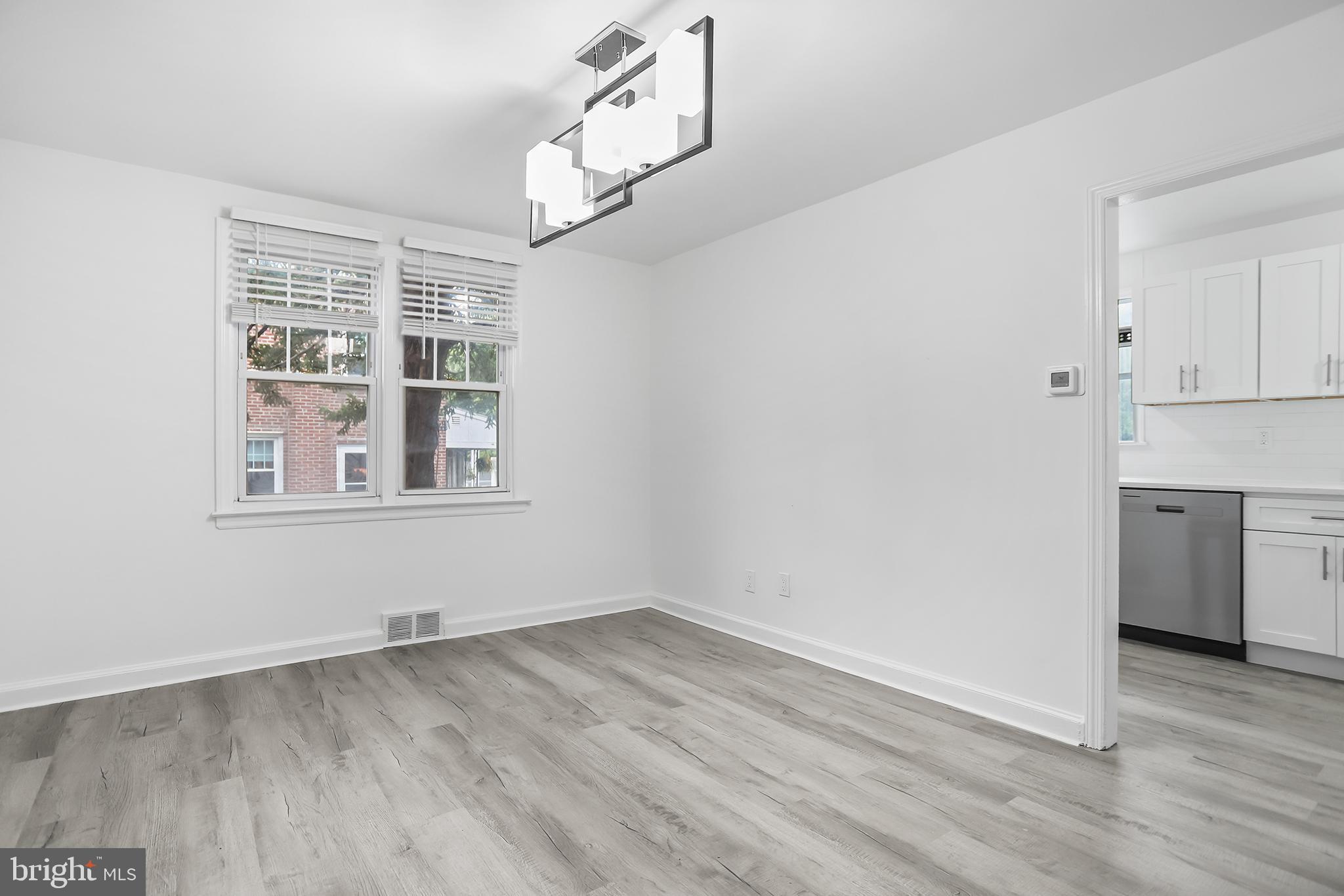 1913 Winton Avenue Havertown, PA 19083 - Photo 5 of 17 wooden floor in an empty room with a window