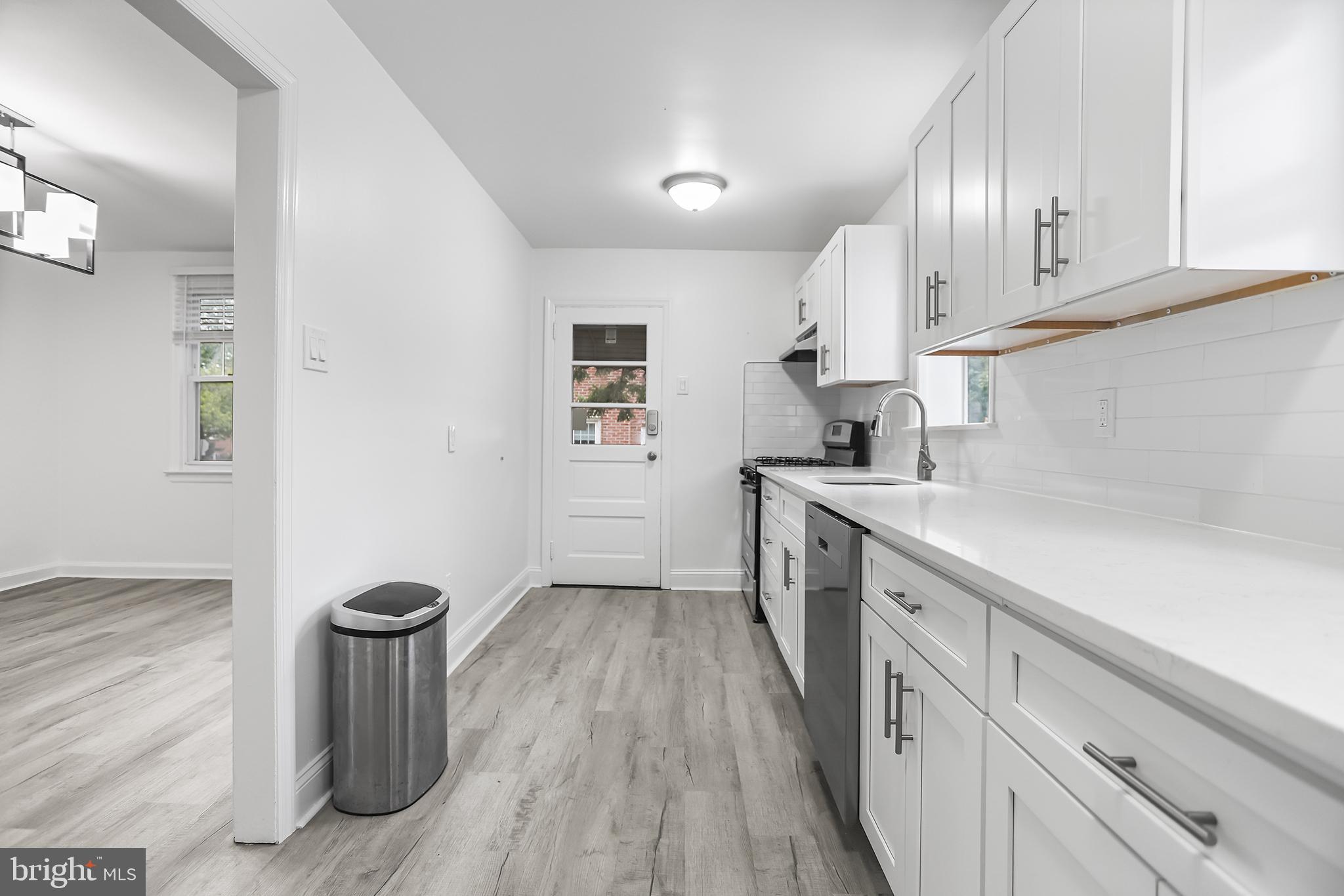 1913 Winton Avenue Havertown, PA 19083 - Photo 8 of 17 a kitchen with sink cabinets and window