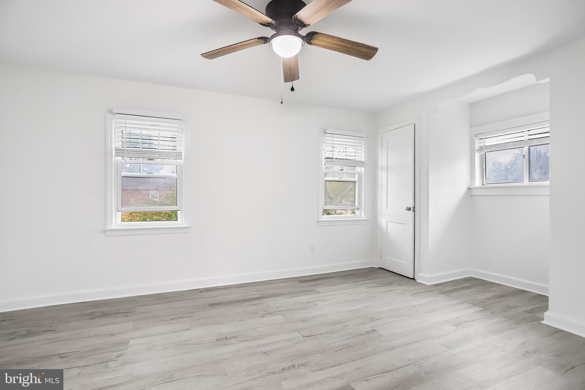 1913 Winton Avenue Havertown, PA 19083 - Photo 9 of 17 a view of an empty room with wooden floor and a window