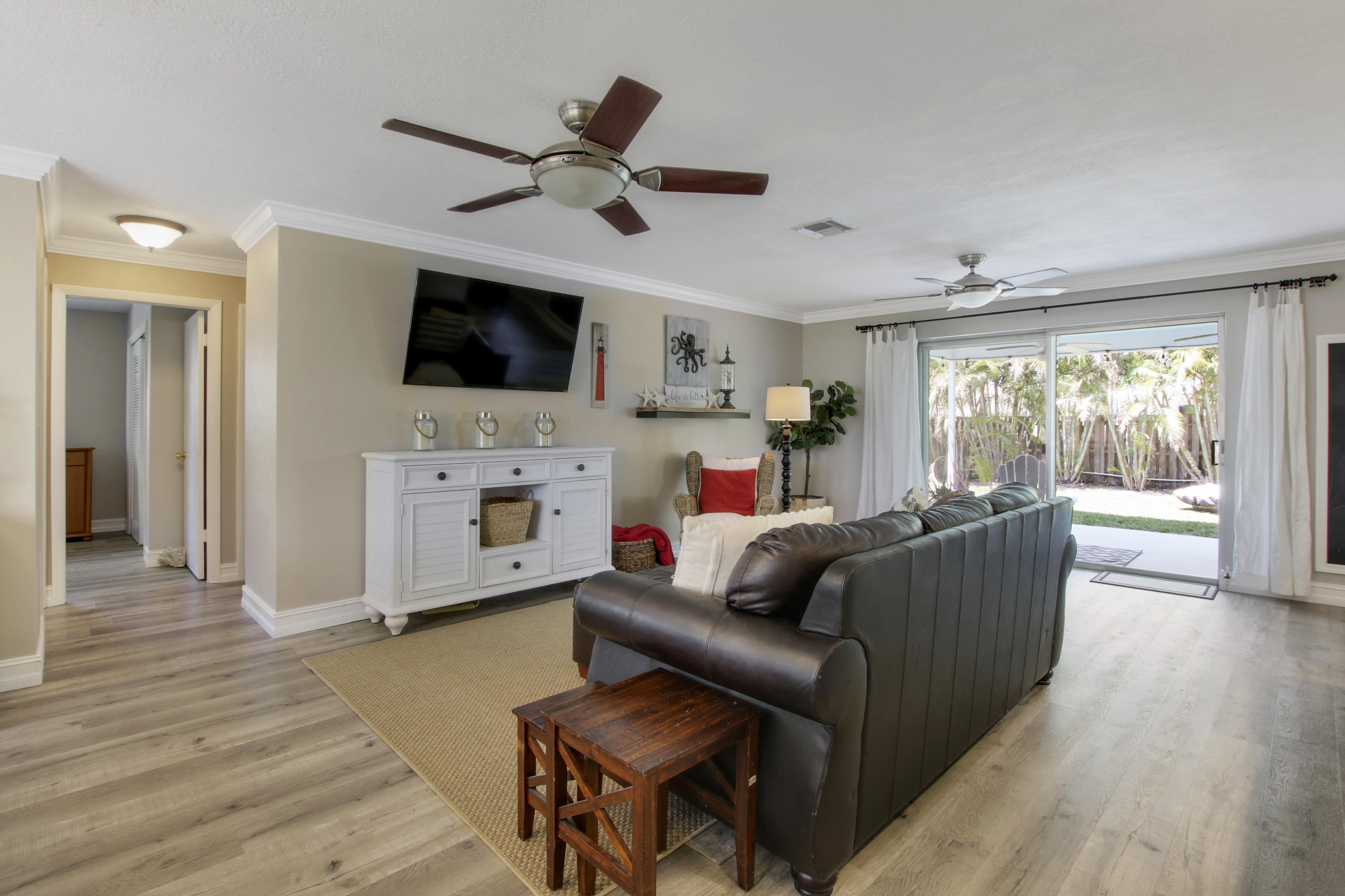 361 Mars Avenue Tequesta, FL 33469 - Photo 12 of 28 a living room with furniture and a flat screen tv