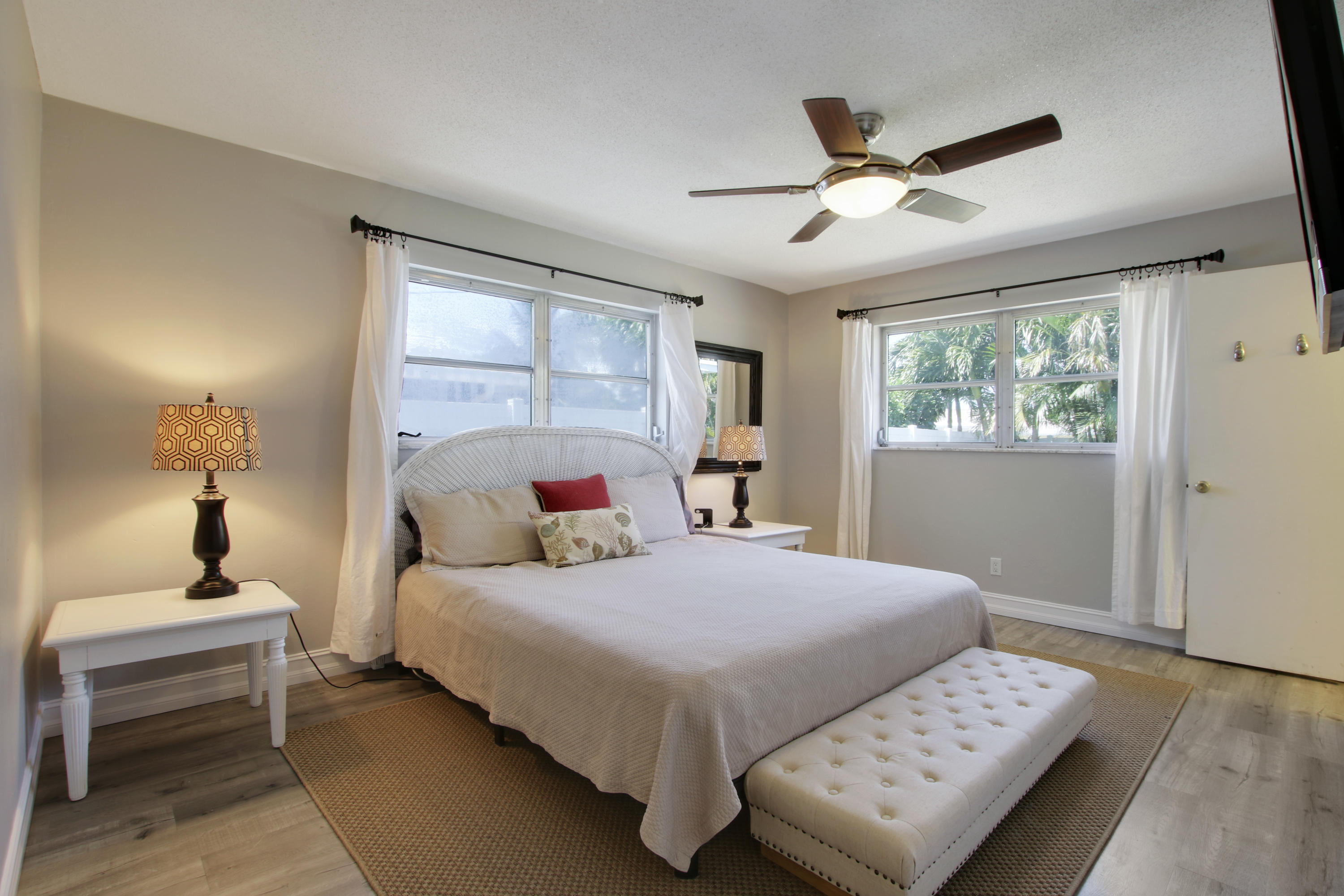 361 Mars Avenue Tequesta, FL 33469 - Photo 16 of 28 a bedroom with a bed and a window