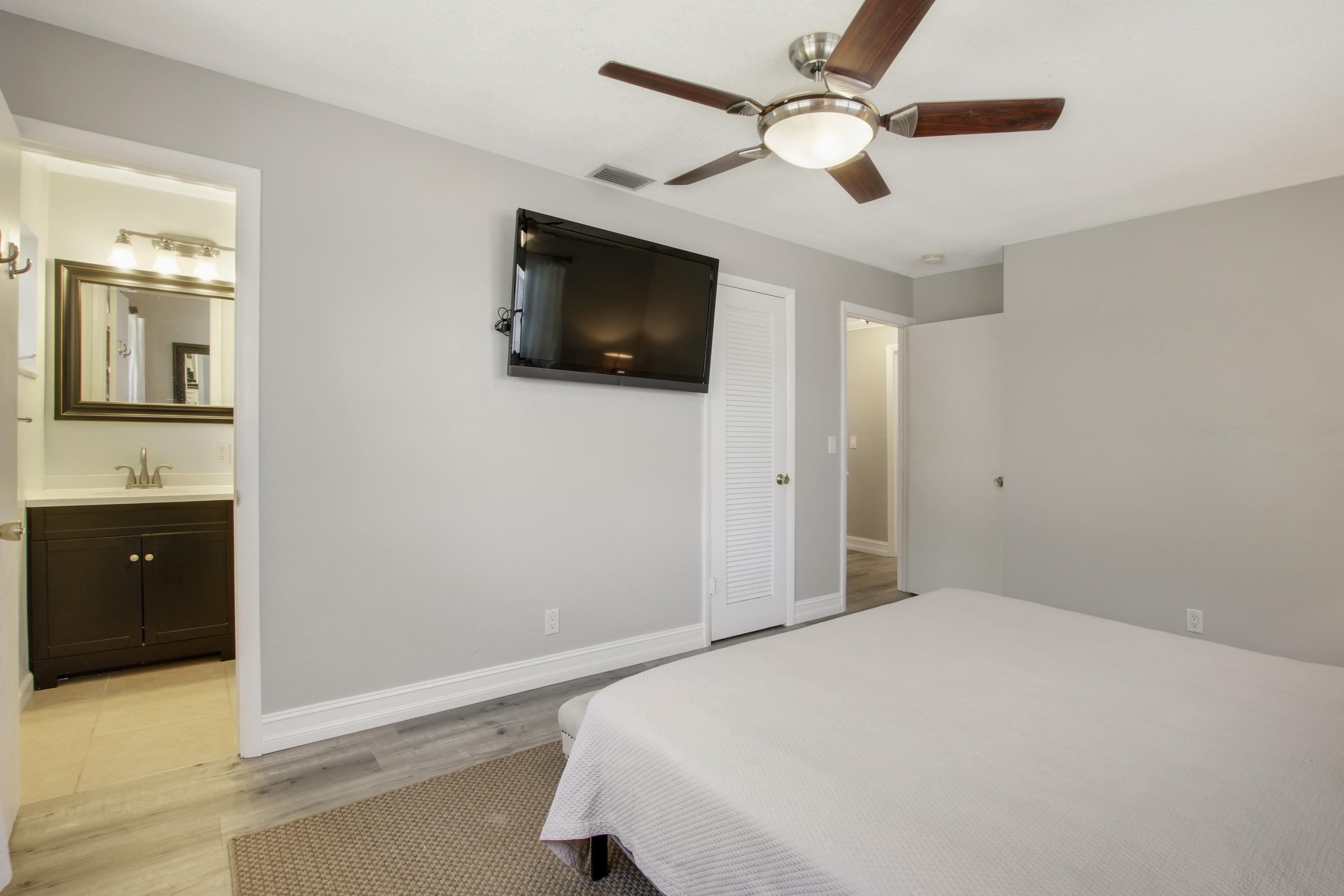 361 Mars Avenue Tequesta, FL 33469 - Photo 17 of 28 a bedroom with a bed and a flat screen tv