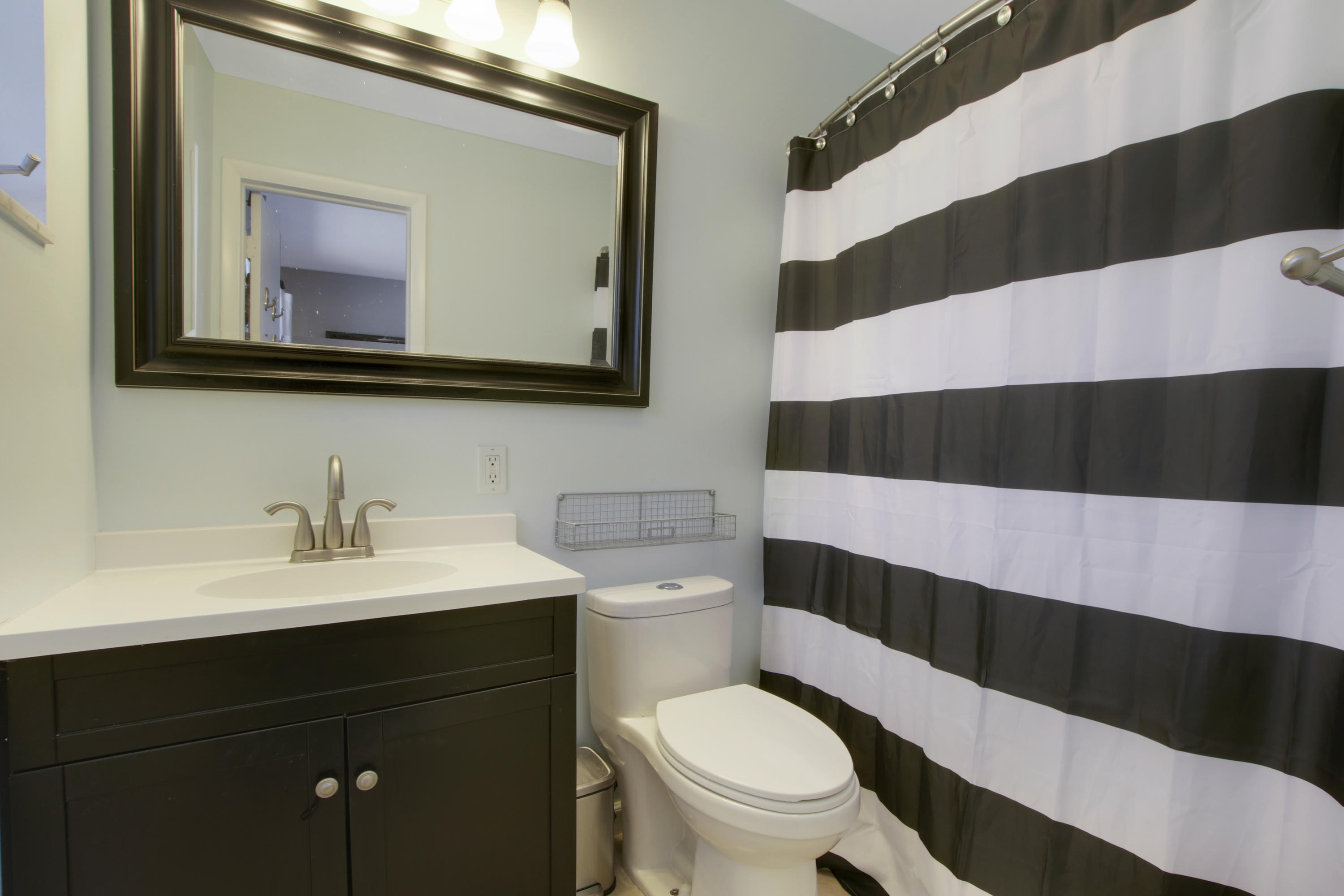 361 Mars Avenue Tequesta, FL 33469 - Photo 18 of 28 a bathroom with a sink and a mirror