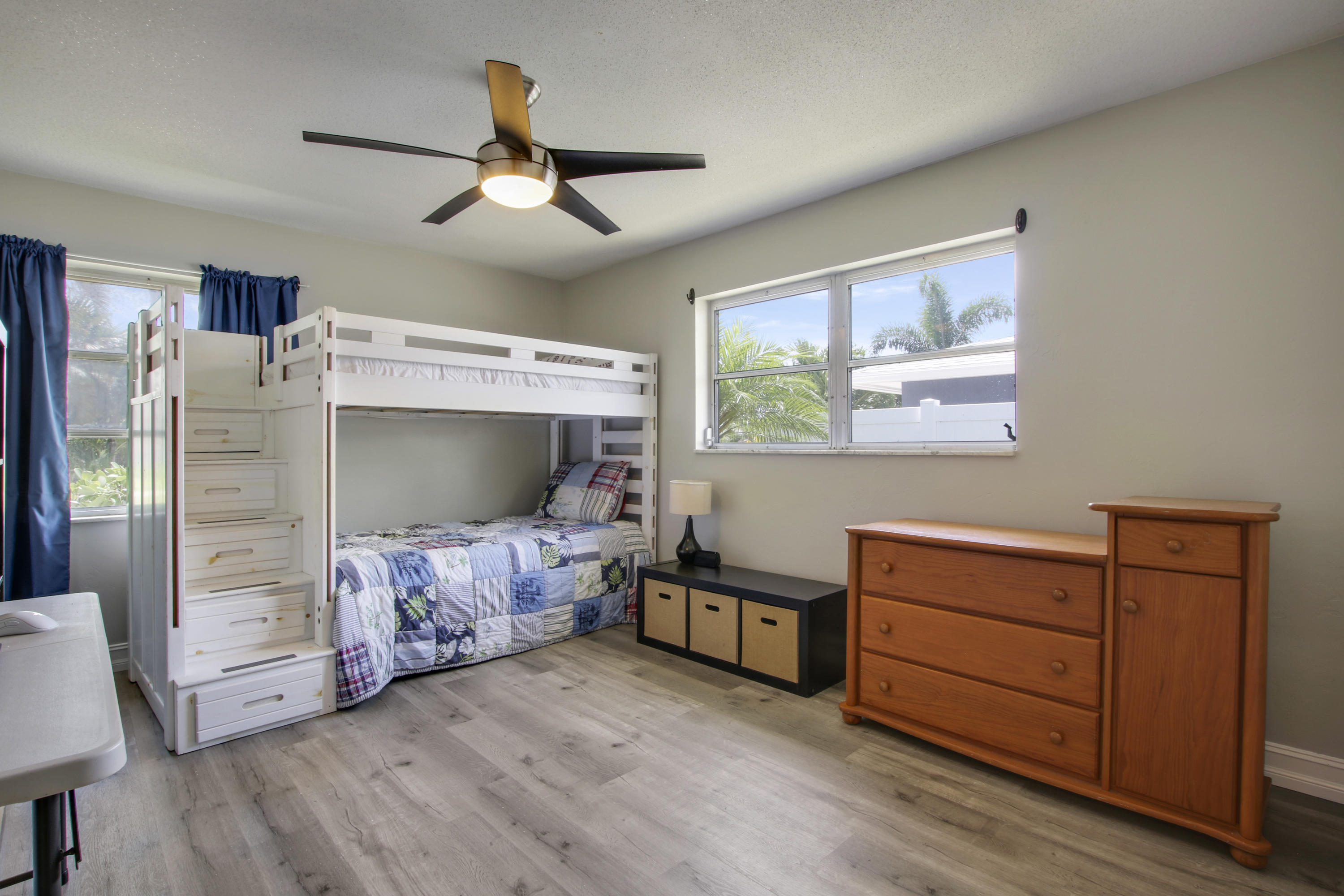 361 Mars Avenue Tequesta, FL 33469 - Photo 19 of 28 a bedroom with furniture and a ceiling fan