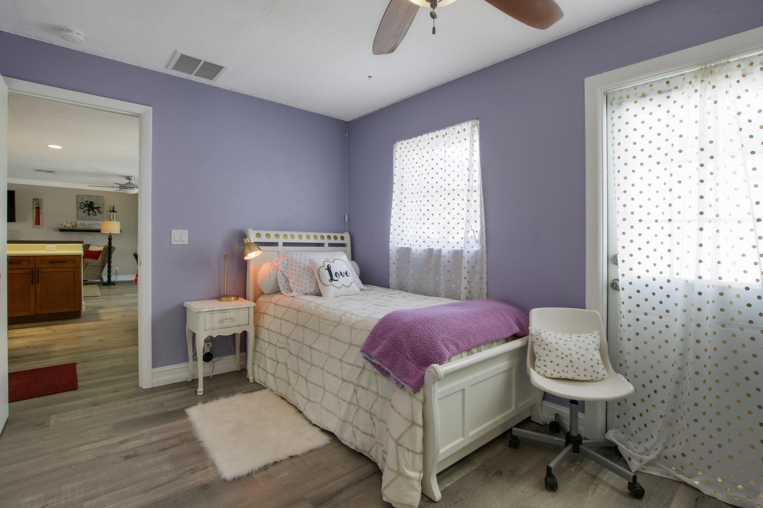 361 Mars Avenue Tequesta, FL 33469 - Photo 22 of 28 a bedroom with a bed a table and chair