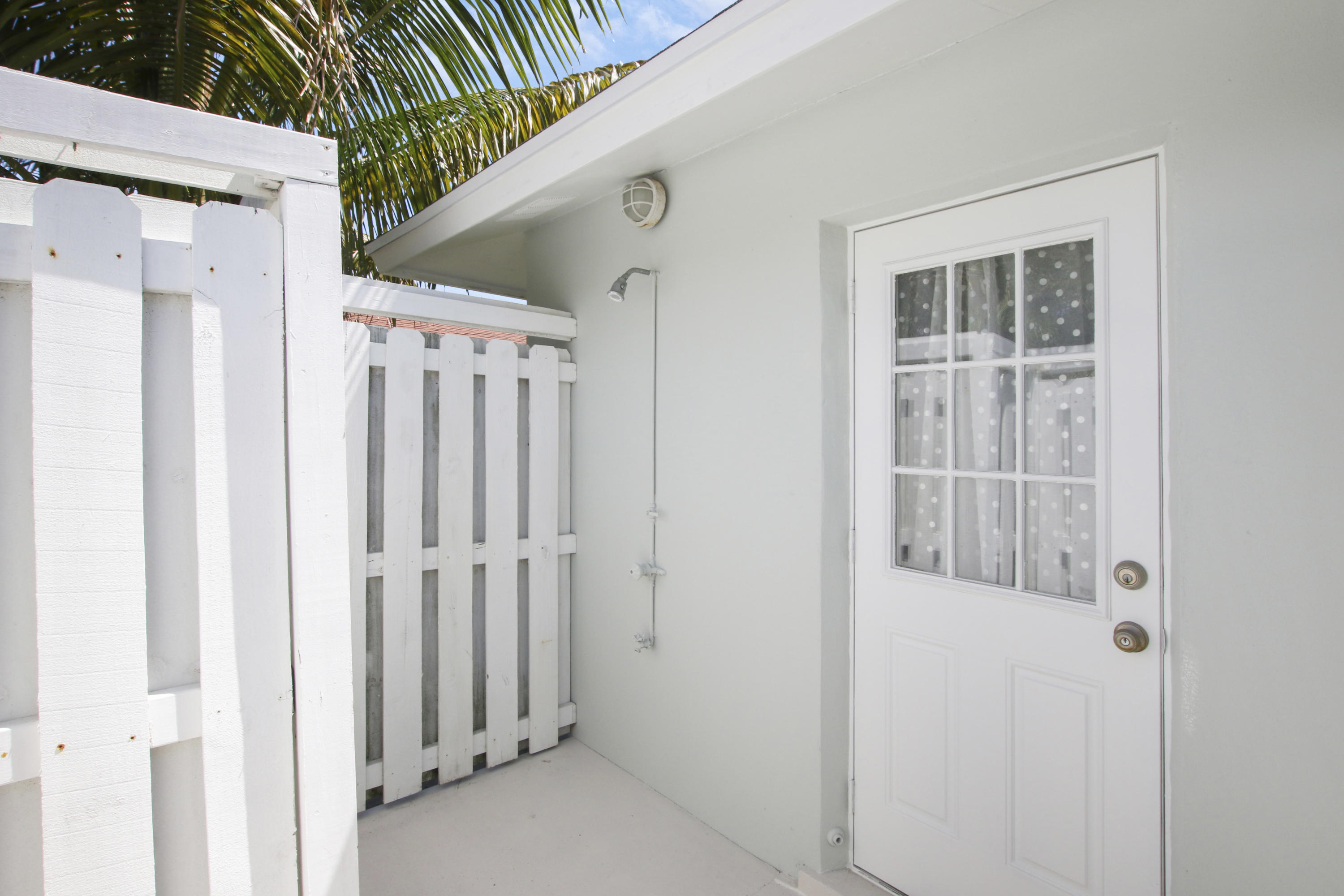 361 Mars Avenue Tequesta, FL 33469 - Photo 28 of 28 a view of wooden door and outdoor space