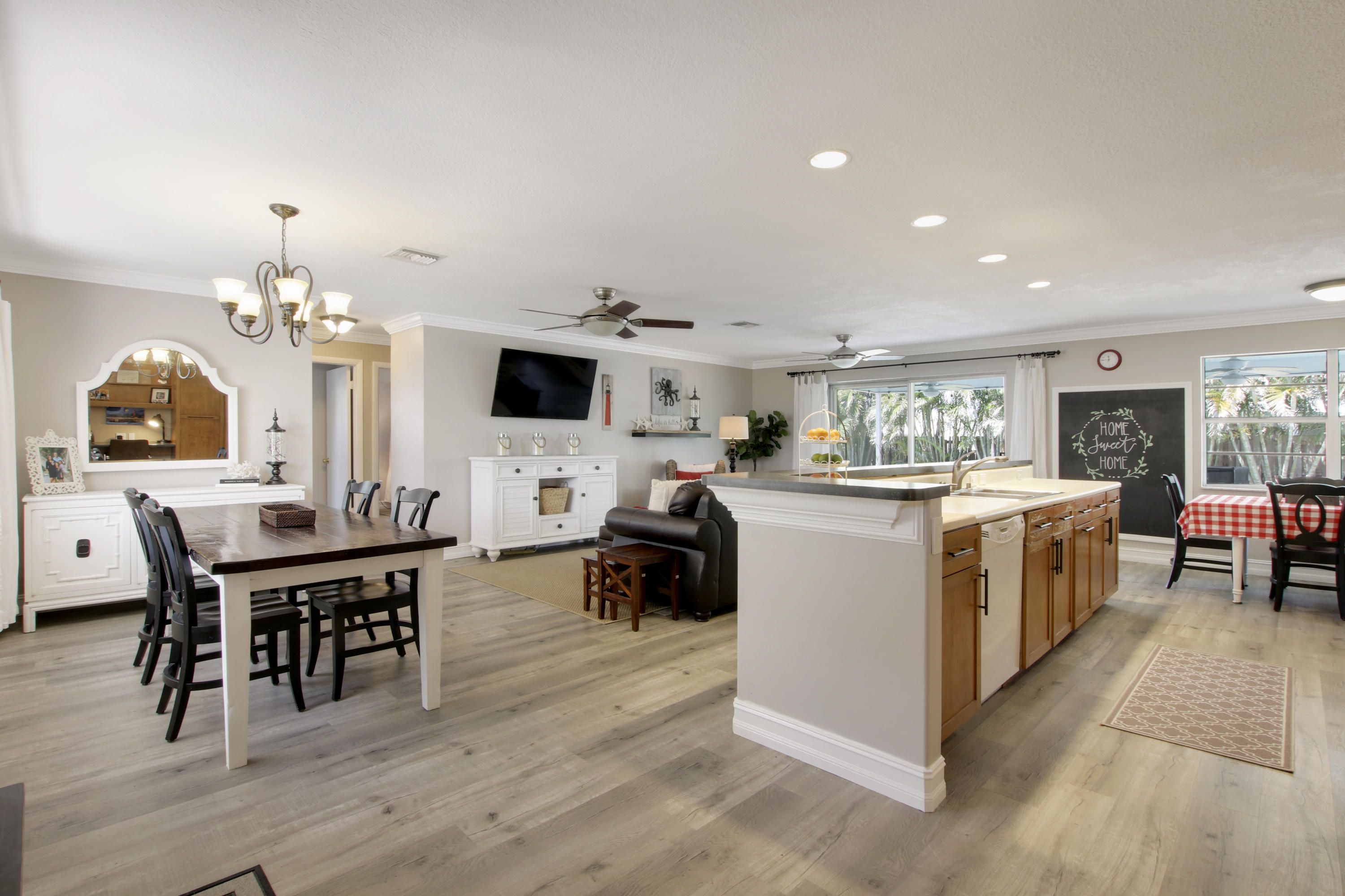 361 Mars Avenue Tequesta, FL 33469 - Photo 4 of 28 a kitchen with a dining table chairs and view kitchen