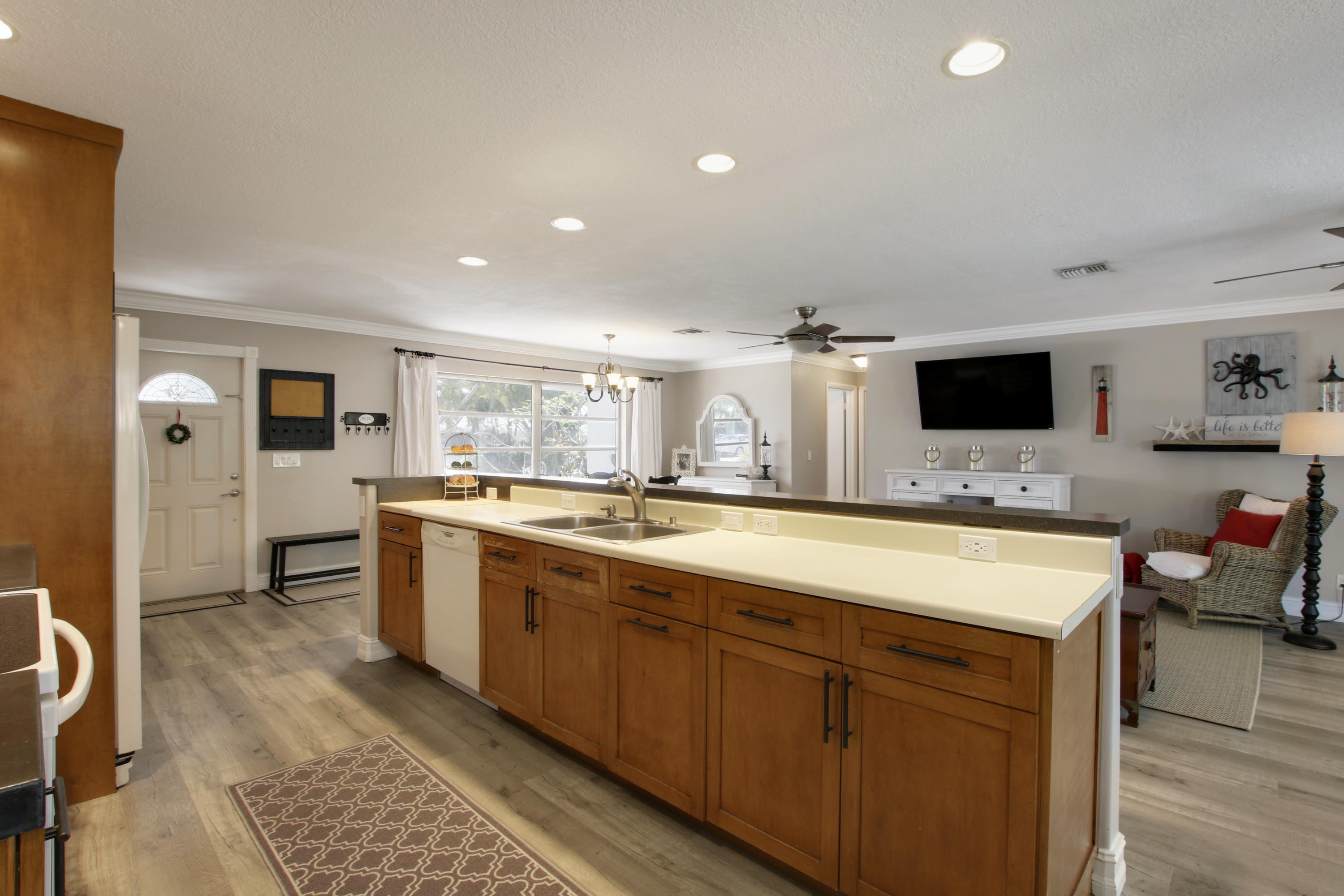 361 Mars Avenue Tequesta, FL 33469 - Photo 8 of 28 a large kitchen with a large counter top space appliances and cabinets
