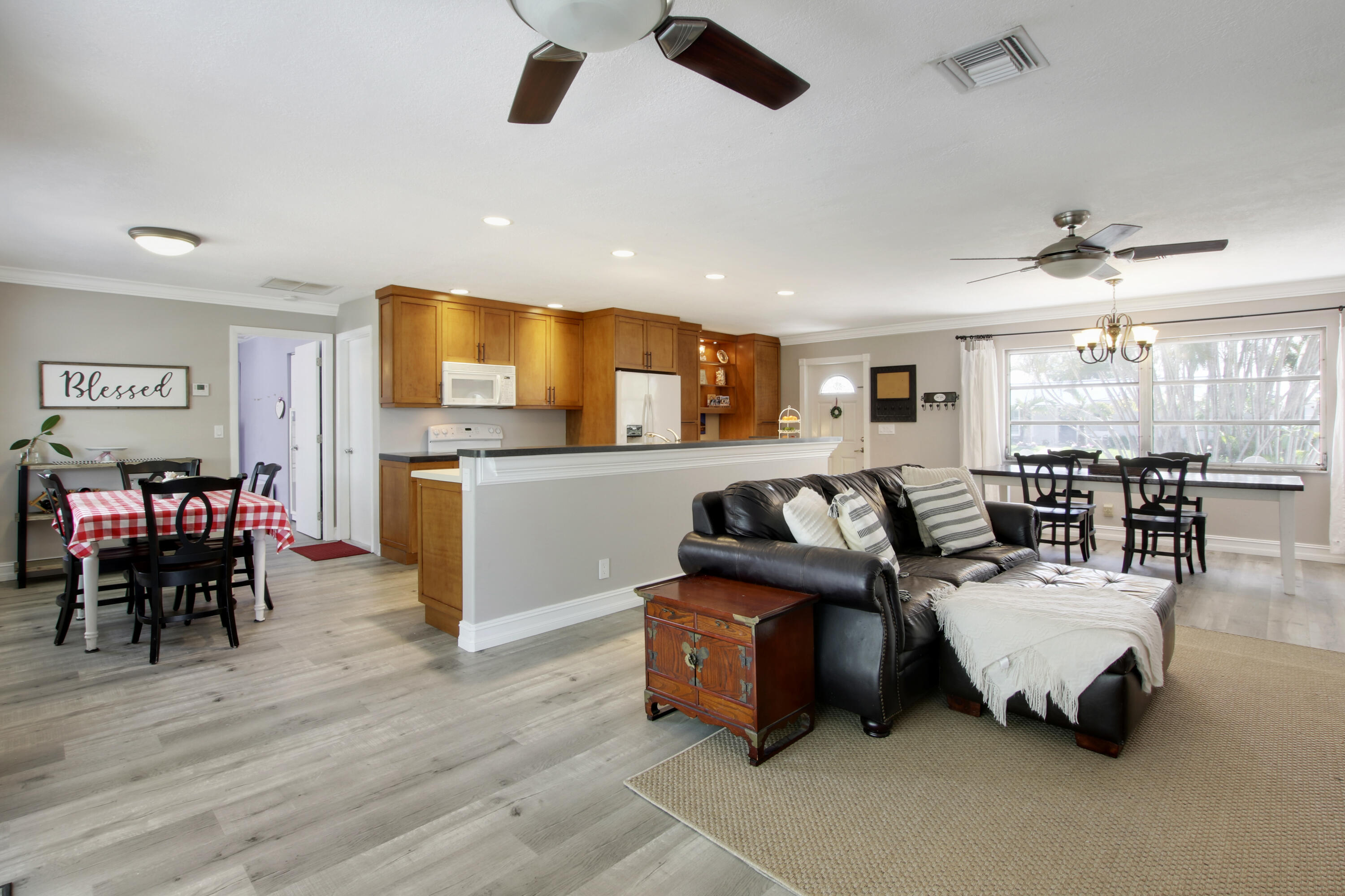 361 Mars Avenue Tequesta, FL 33469 - Photo 10 of 28 a living room with furniture and kitchen view