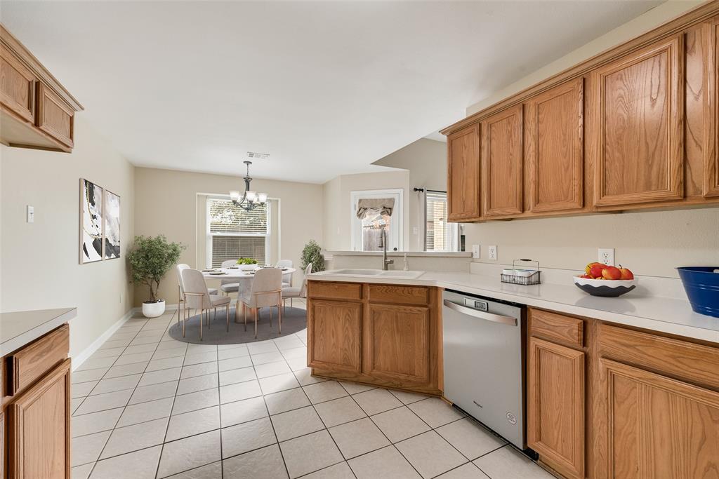 526 Morningside Court Midlothian, TX 76065 - Photo 5 of 28 a kitchen with a sink cabinets and window