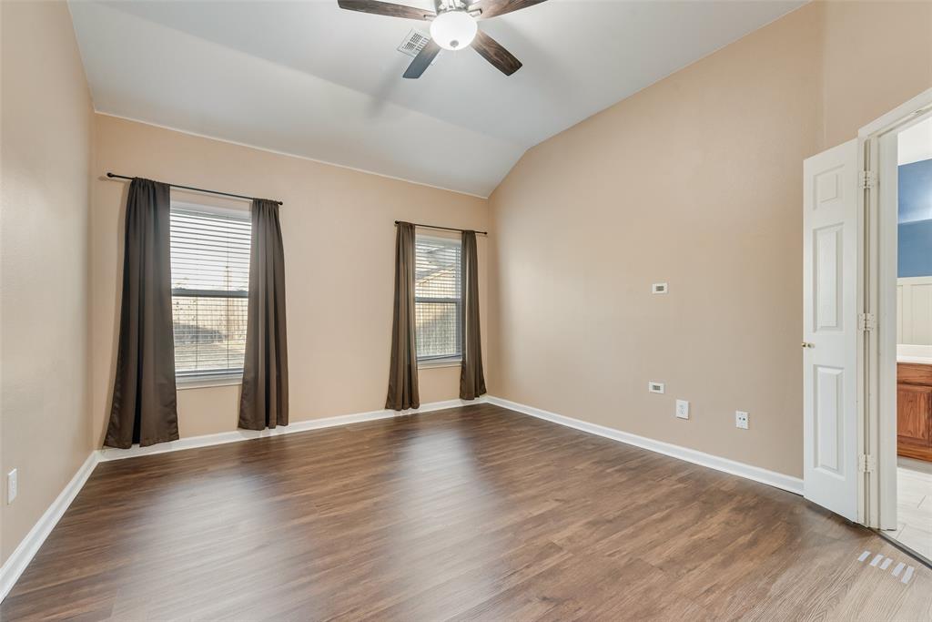 526 Morningside Court Midlothian, TX 76065 - Photo 8 of 28 an empty room with wooden floor and windows