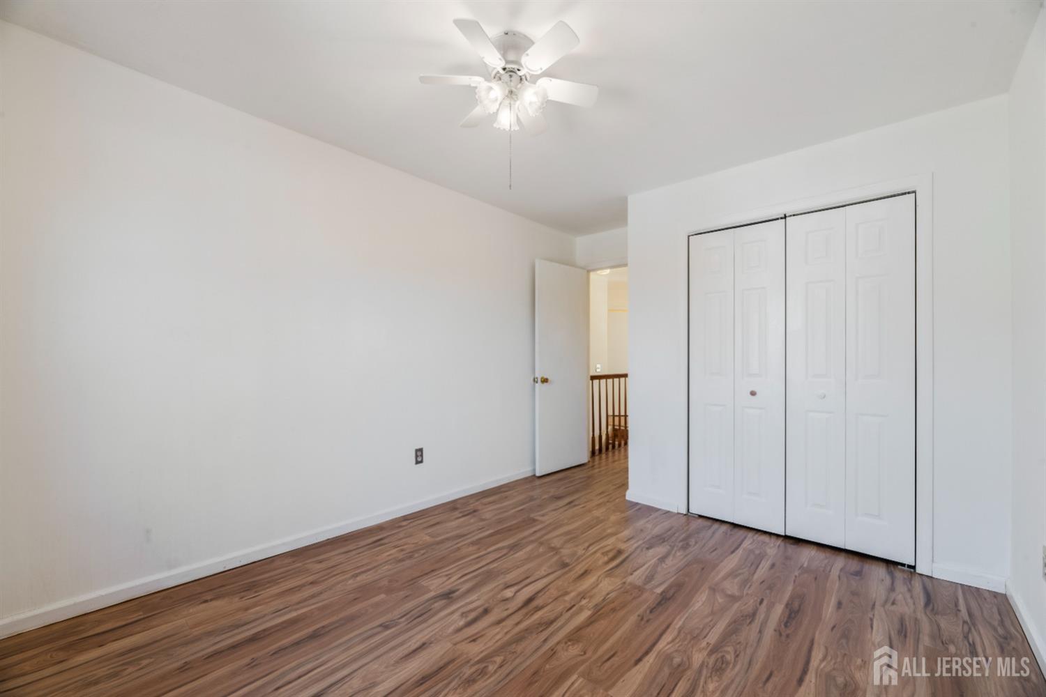 95 Lawrence Street New Brunswick, NJ 08901 - Photo 14 of 25 a view of an empty room with wooden floor
