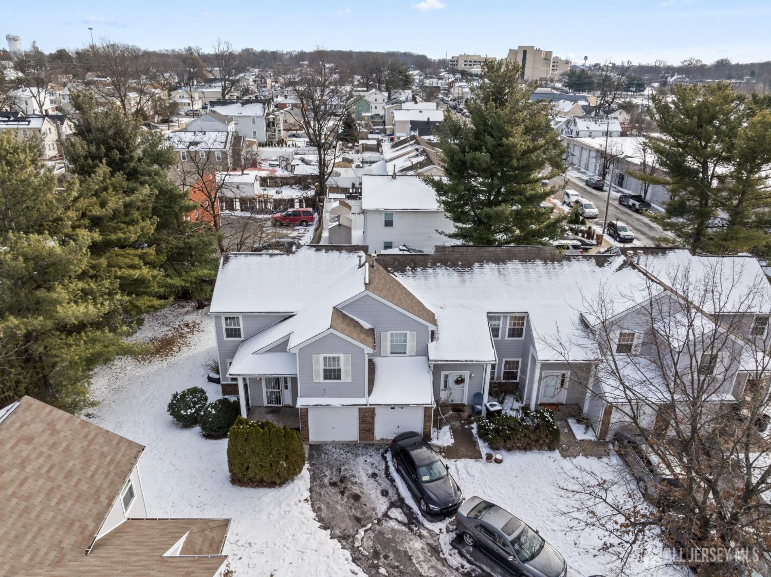 95 Lawrence Street New Brunswick, NJ 08901 - Photo 2 of 25 an aerial view of a house with a mountain in the background