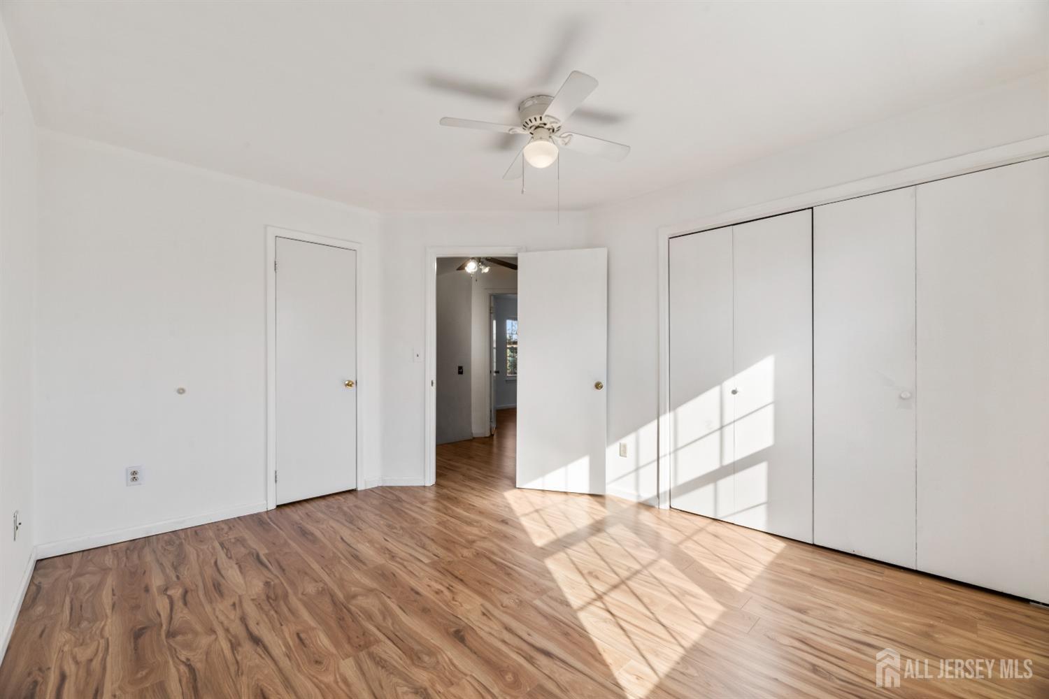 95 Lawrence Street New Brunswick, NJ 08901 - Photo 10 of 25 a view of an empty room with wooden floor