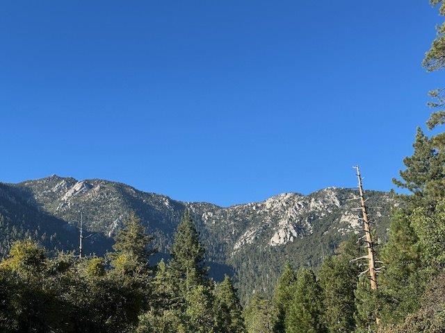 0 Howland Road Idyllwild, CA 92549 - Photo 15 of 16 a view of a large building with mountains in the background