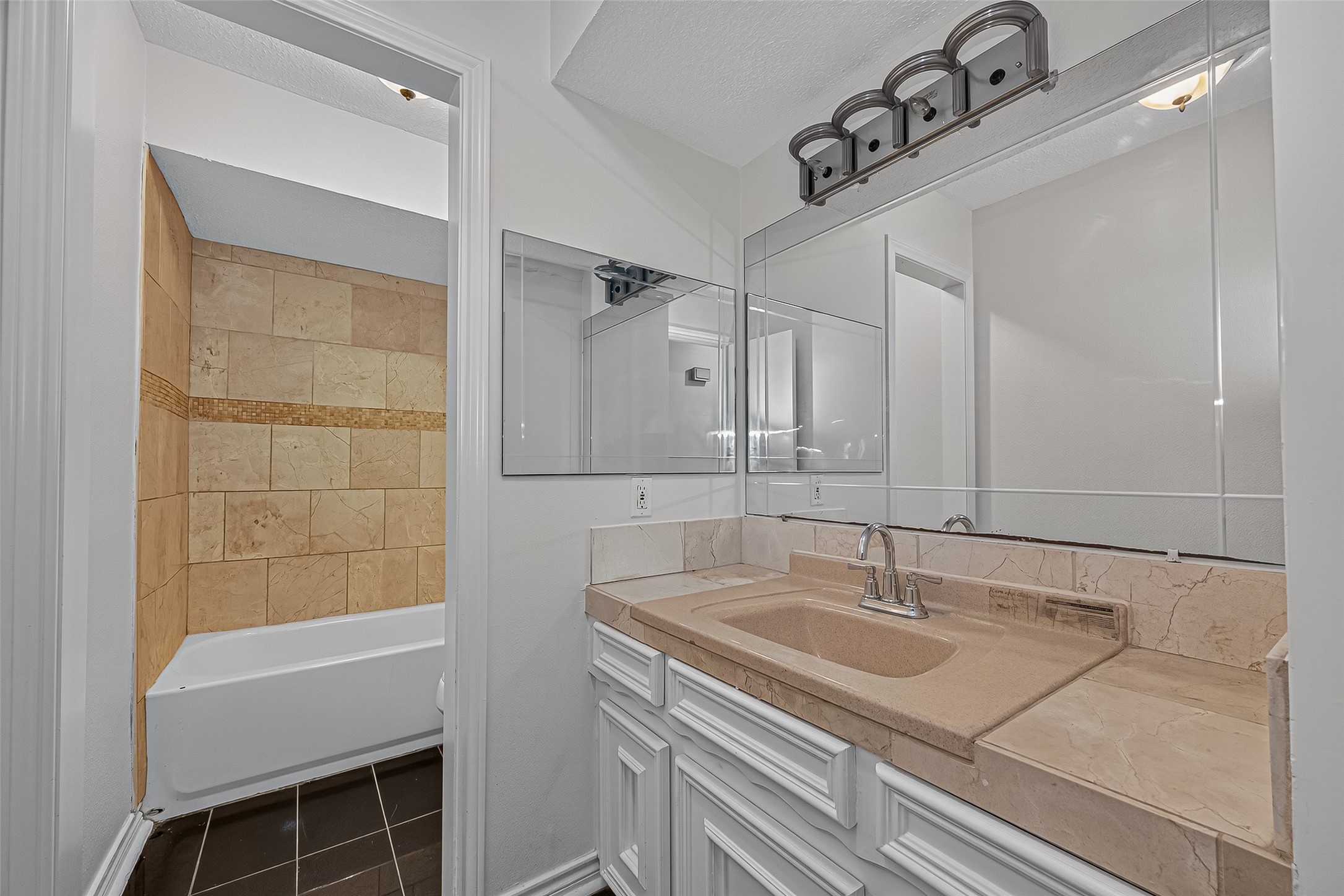 3122 Kueck Road Rosenberg, TX 77471 - Photo 11 of 25 a bathroom with a sink and a mirror