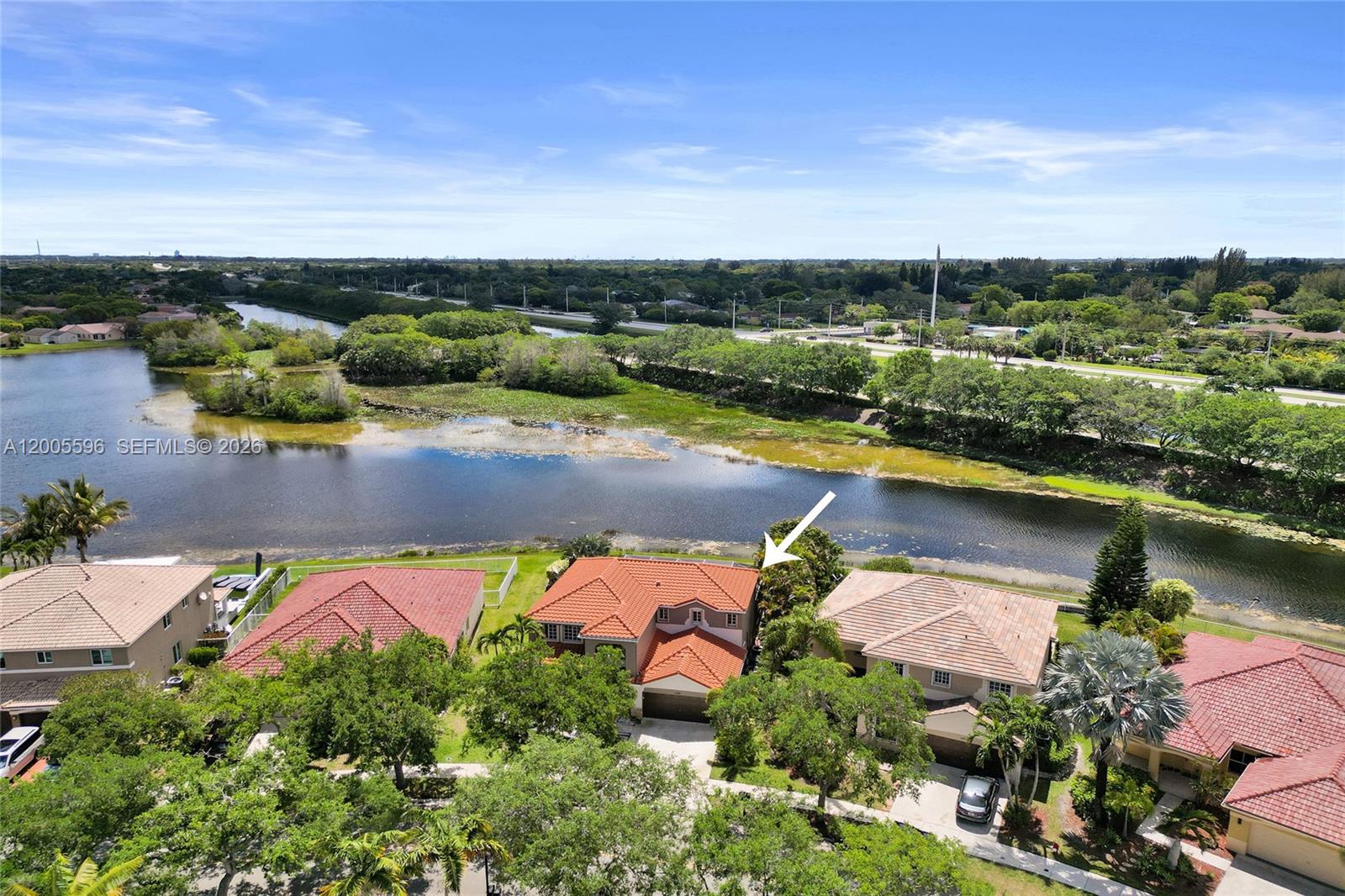 4281 Laurel Ridge Circle Weston, FL 33331 - Photo 73 of 80 an aerial view of a house with a lake view