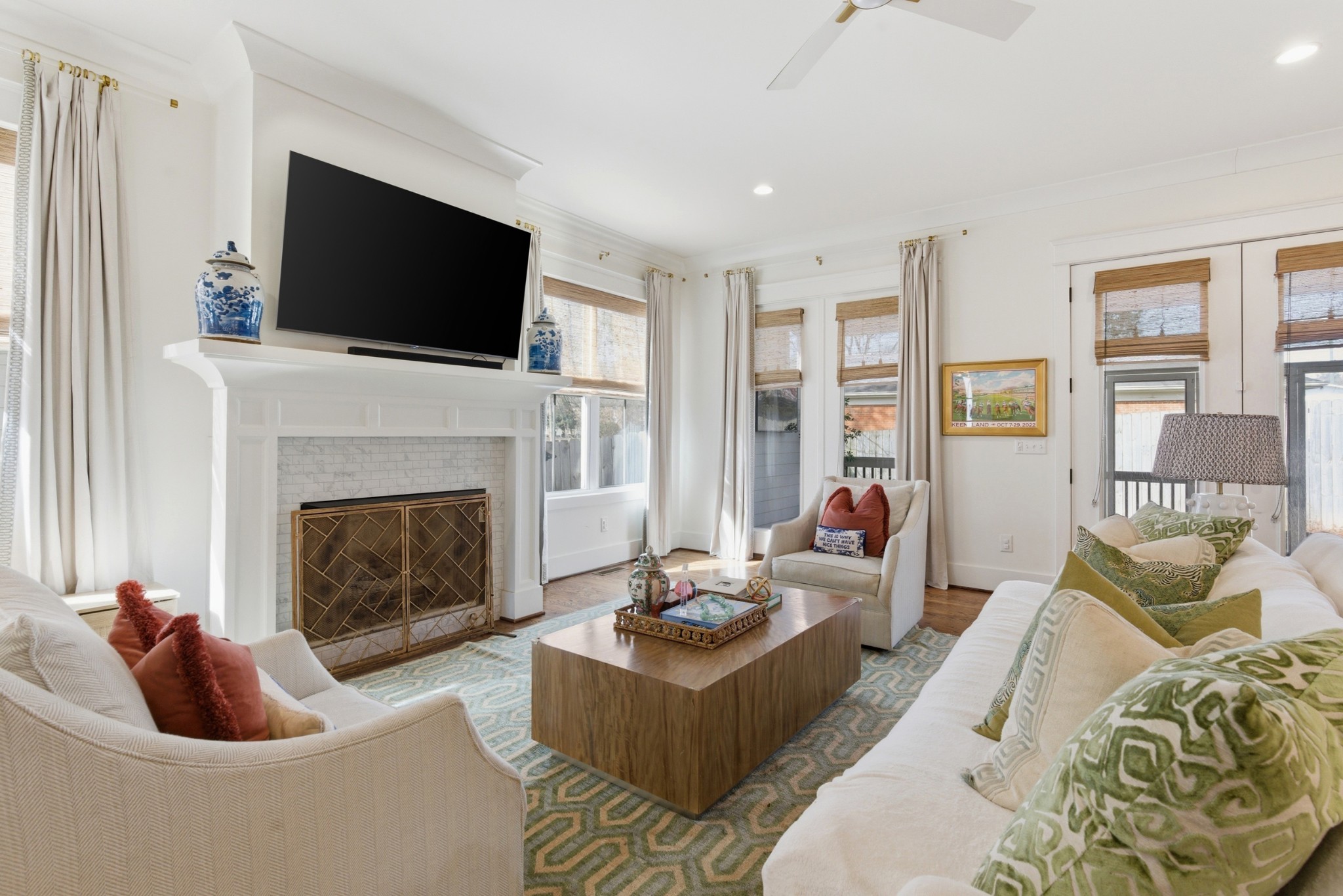 171 Rural Avenue Nashville, TN 37209 - Photo 4 of 43 a living room with furniture a fireplace and a flat screen tv