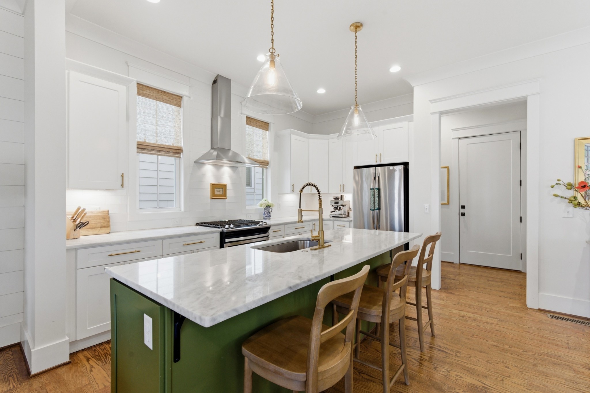 171 Rural Avenue Nashville, TN 37209 - Photo 6 of 43 a kitchen with granite countertop a table chairs in it and wooden floors