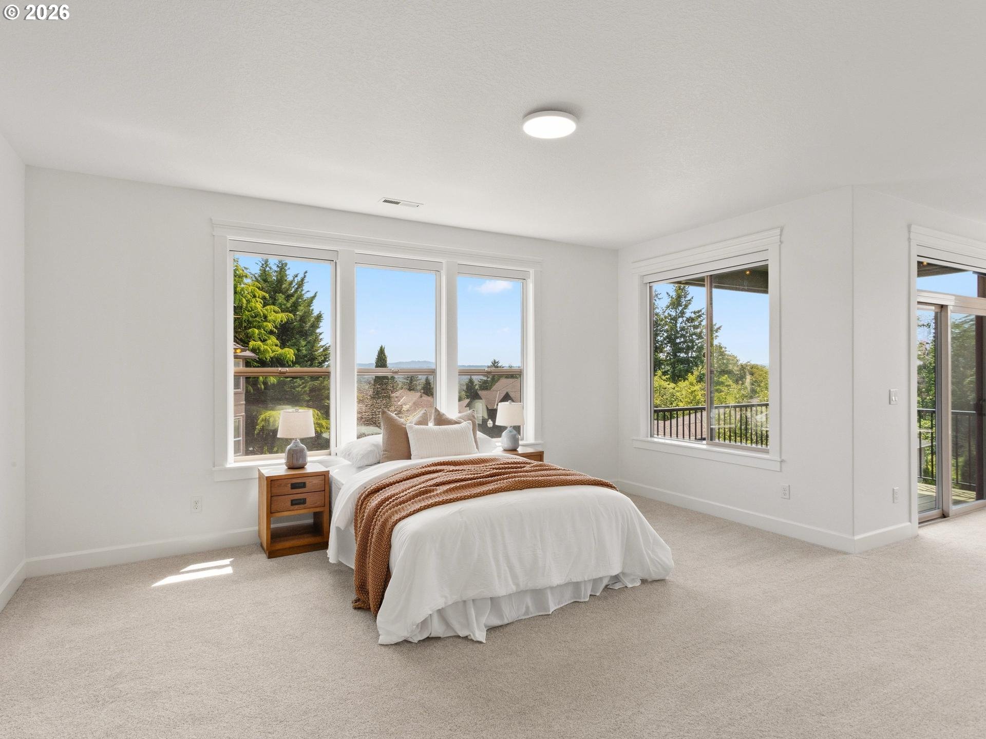 1012 Northwest Goodwin Street Camas, WA 98607 - Photo 17 of 44 a bed sitting in a spacious bedroom next to a window