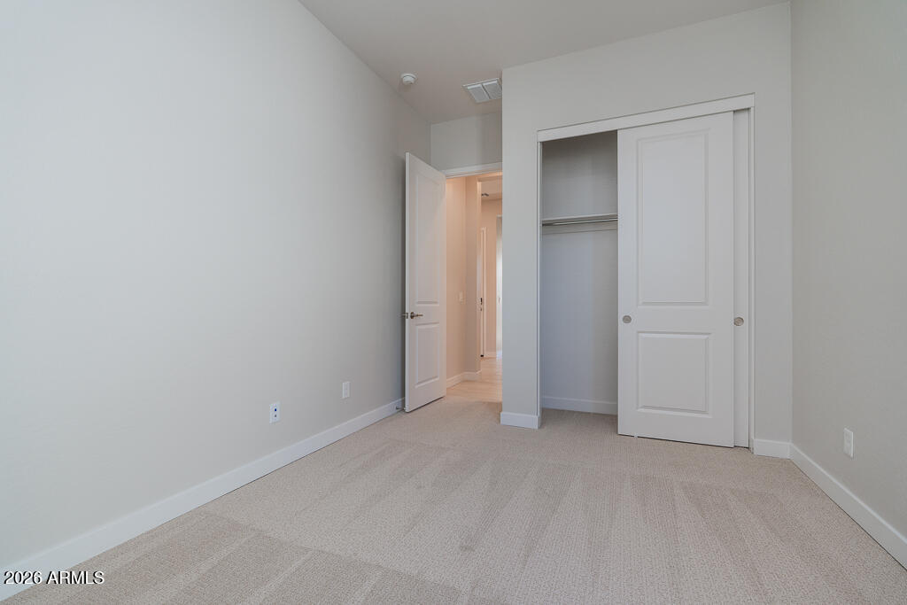 5879 South Red Rock Street Gilbert, AZ 85298 - Photo 12 of 18 a view of an empty room