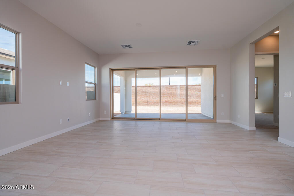 5879 South Red Rock Street Gilbert, AZ 85298 - Photo 4 of 18 a view of an empty room with a window