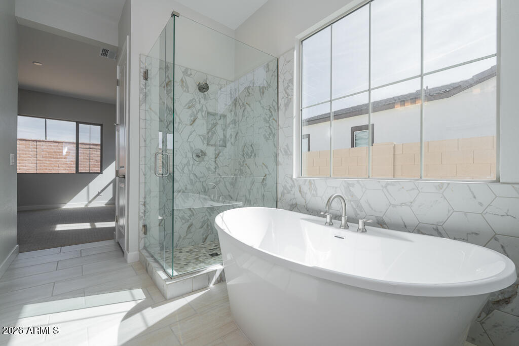 5879 South Red Rock Street Gilbert, AZ 85298 - Photo 8 of 18 a white toilet sitting next to a bathroom sink