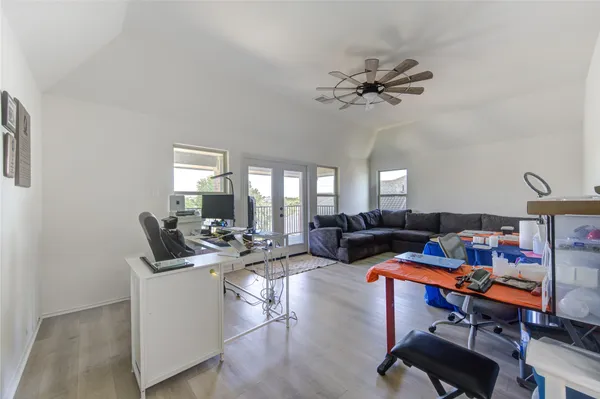a bedroom with furniture and a book shelf